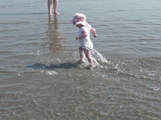LiliBee chases the waves.